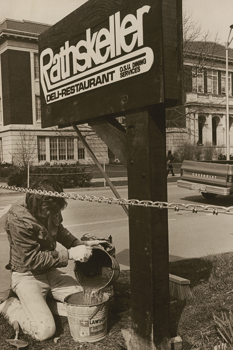 Photo of a worker installing the Rathskeller sign 