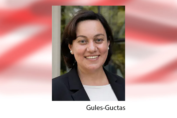 Headshot of Esra Gules-Guctas on red and white background