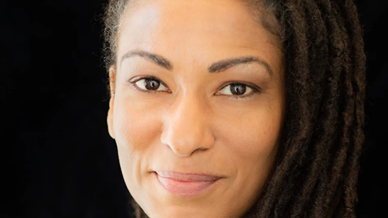 Dr. Ruha Benjamin smiling