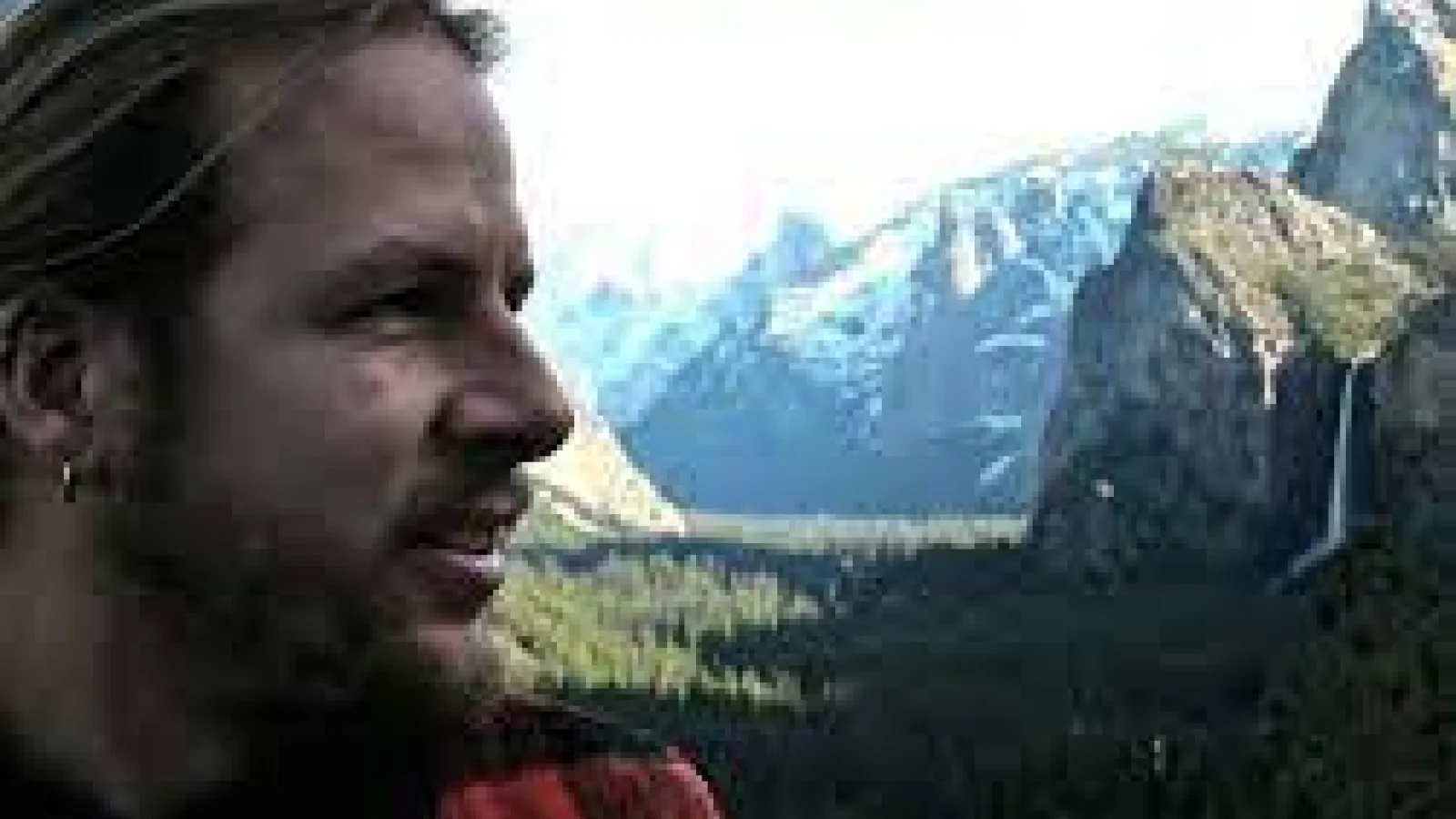 Joachim Moortgat with a valley and mountain range in the background