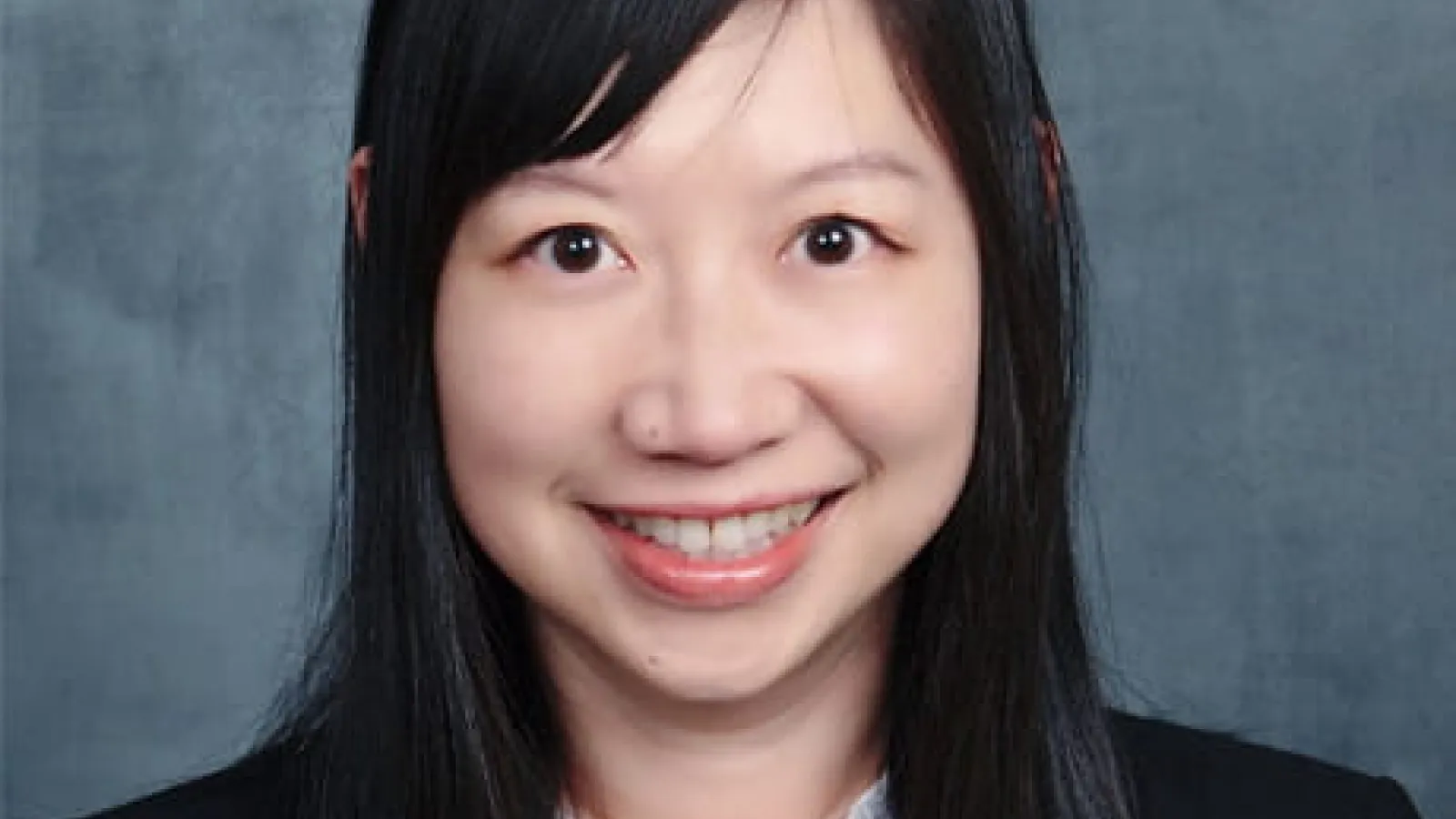 Dr. Weidan Cao headshot on a gray background
