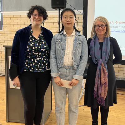 Dr. Tanya Berger-Wolf, Fangyi Wang, and Dr. Elena Irwin standing together and smiling