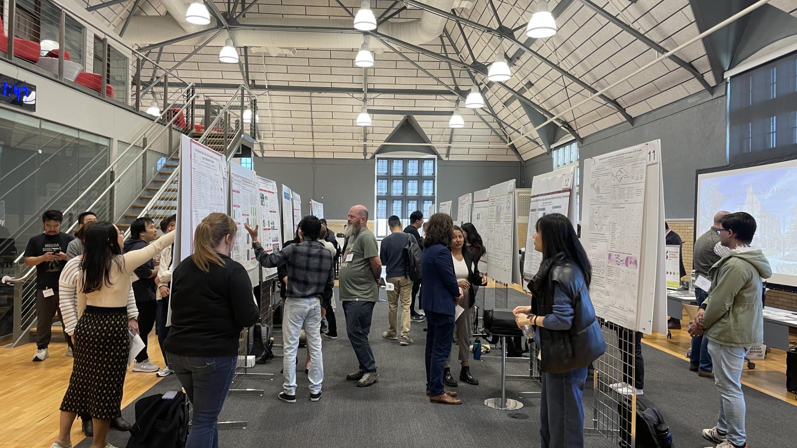 Students, faculty, and professionals at the Poster Presentations