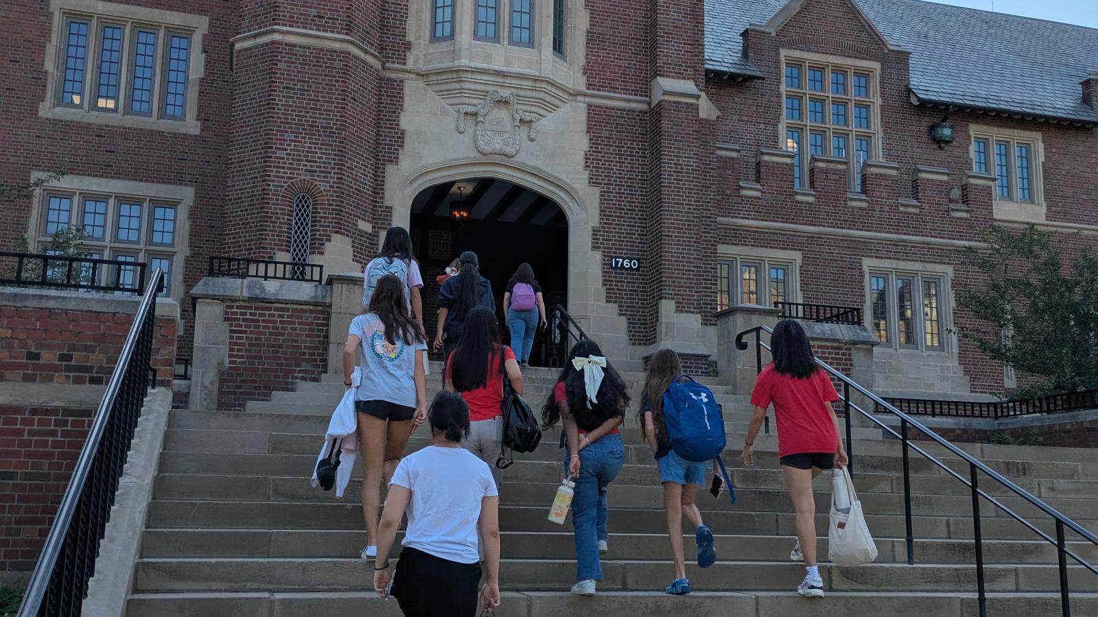 students walking up steps to pomerene hall