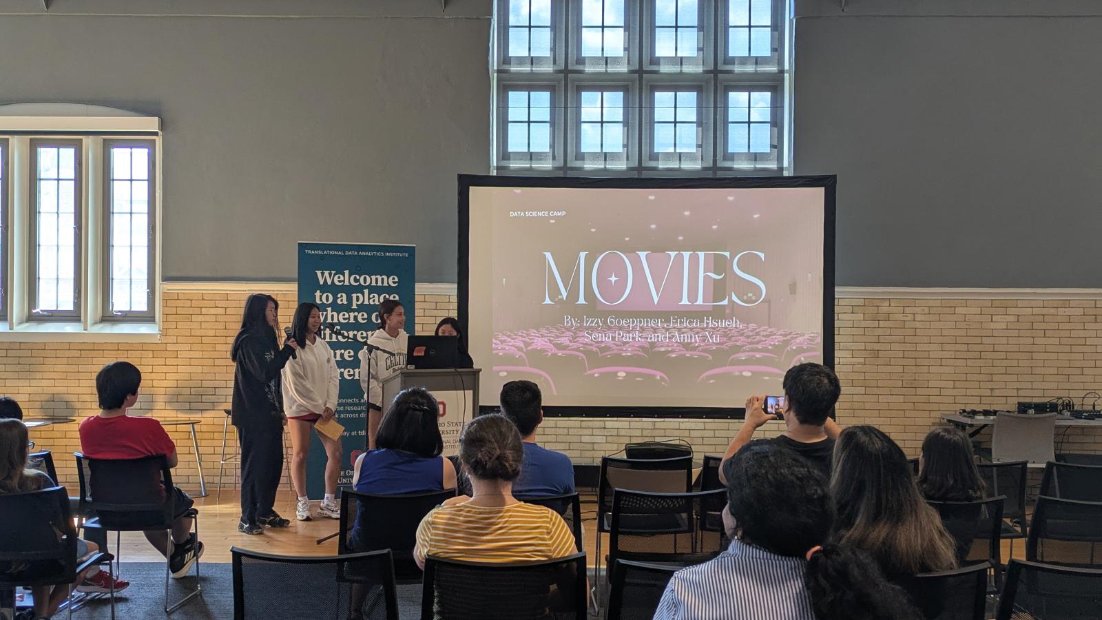 students presenting on movie data