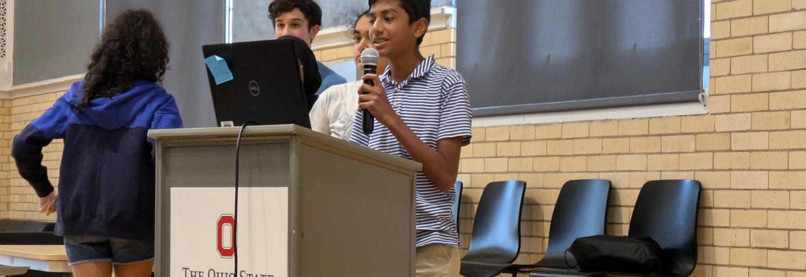 Summer camp students giving presentations