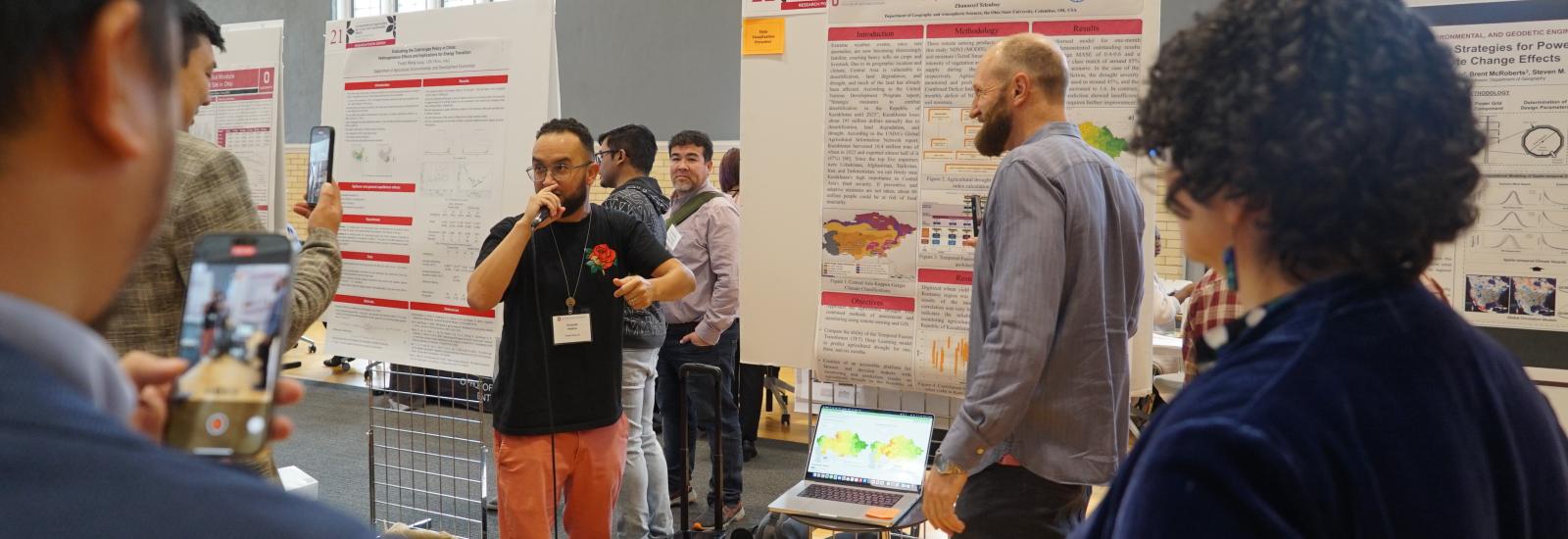 Two science rappers performing at a poster session