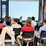 A person presenting in front of a group