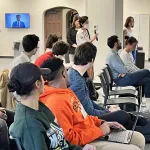 Audience members having a question and answer 