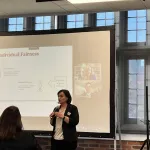 A person presenting in front of a group
