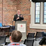 A person presenting in front of a group