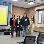 A group of four people presenting