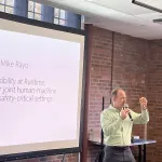 A person presenting in front of a group