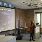 A person presenting in front of a group