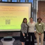people presenting in front of a group