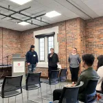 A person presenting in front of a group