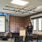 A person presenting in front of a group