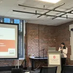 A person presenting in front of a group