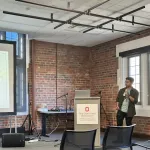 A person presenting in front of a group