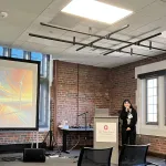 A person presenting in front of a group