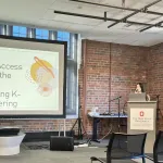 A person presenting in front of a group